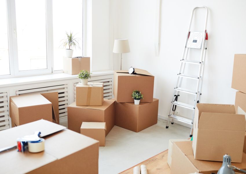 boxes-in-empty-room-with-step-ladder