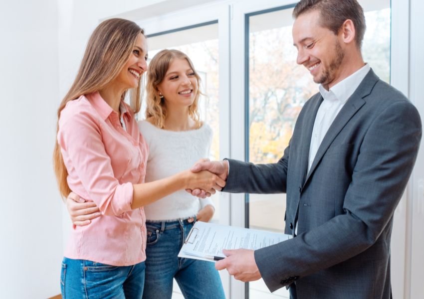 two-people-shaking-hands-with-another